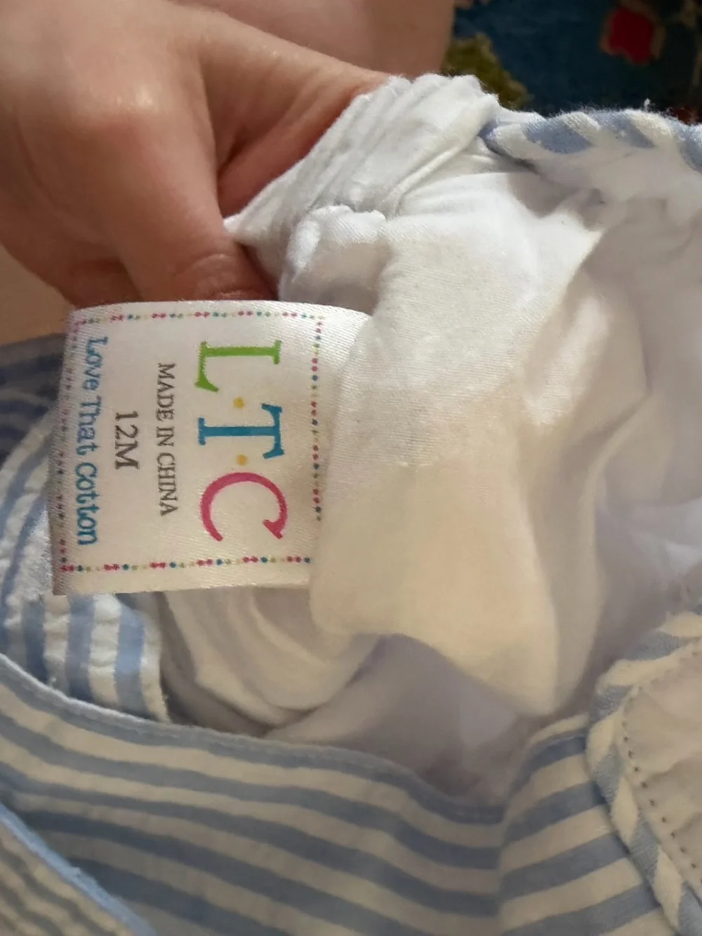 White Seersucker Baby Bib Romper with Blue Embroidered Sunshine